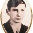 Portrait photograph of Janek Wiśniewski on his grave